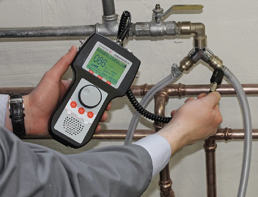 Plumber testing pipes with electronic leak detection equipment in Apollo Beach