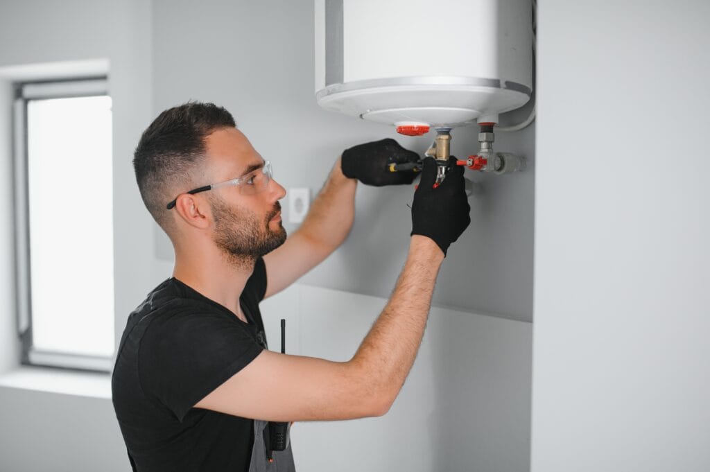 Technician performing water heater maintenance in Apollo Beach